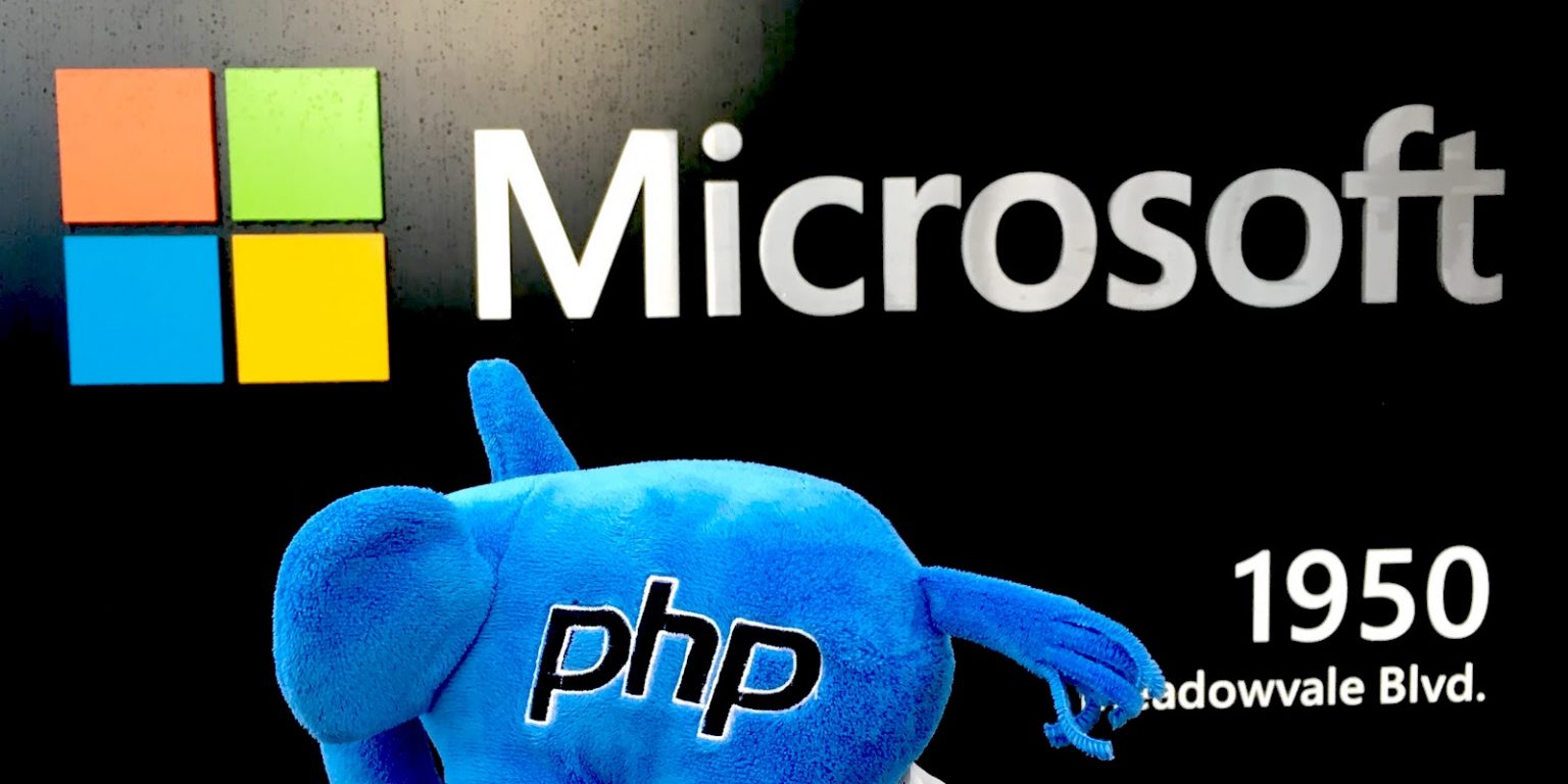 A php elephpant in front of a Microsoft sign